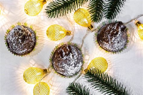 Top view of chocolate cupcakes with christmas tree branches and a luminous garland - Creative ...