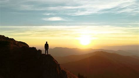 The male standing on the mountain and enjoying the beautiful sunset Stock Video Footage ...