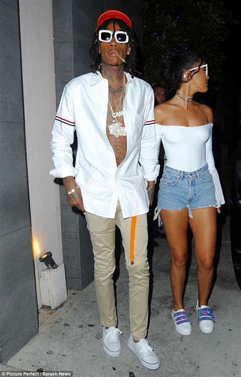 MZ: Getting serious! Wiz Khalifa holds hands with his girlfriend during ...