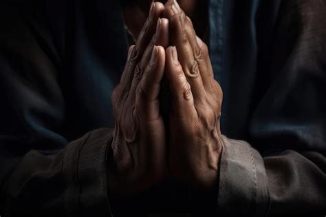 Premium Photo | A man praying with his hands together