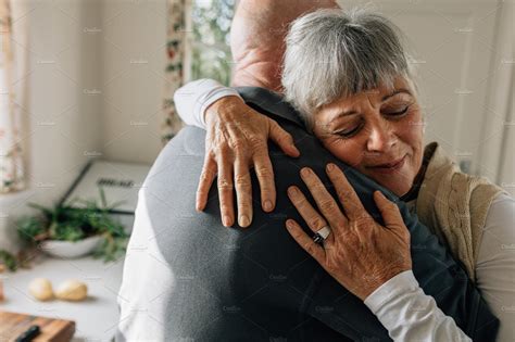 Senior couple hugging each other | High-Quality People Images ~ Creative Market