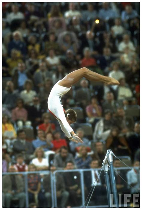 Olga Korbut doing Korbut Flip uneven bars at the Summer Olympics 1972 Photo John D Summer ...