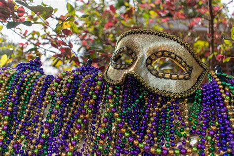 Mardi Gras beads covering wrought iron fence with carnival mask 8724634 ...