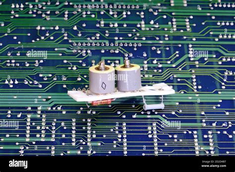 The capacitors on the electronics against circuit board Stock Photo - Alamy