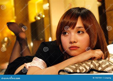 Girl lying on a bed stock image. Image of hotel, hands - 7437551