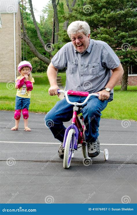 Learning To Ride a Bike with Training Wheels Stock Image - Image of ...