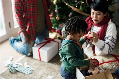 A black family enjoying Christmas | Photo - rawpixel