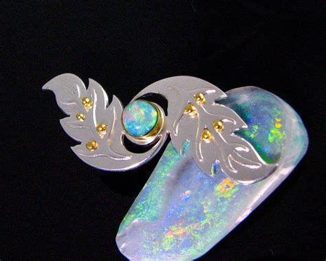 Crystal opal set in 22k, 24k granule accents and pierced s… | Flickr