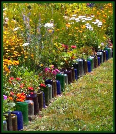 Glass Bottles border flower bed | Bottle garden, Garden edging, Wine bottle garden