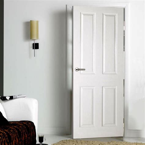 White primed 4 panel door with smooth surfaces and a moulded raised and fielded effect, a low ...