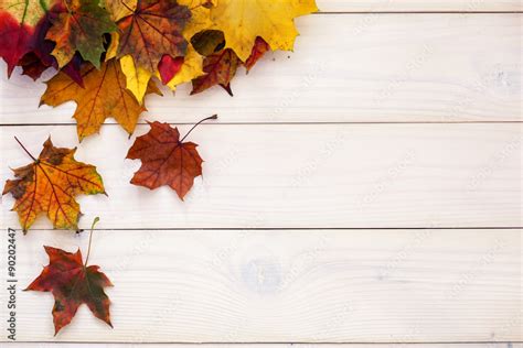 Autumn background with colorful leaves on wooden background Stock Photo ...