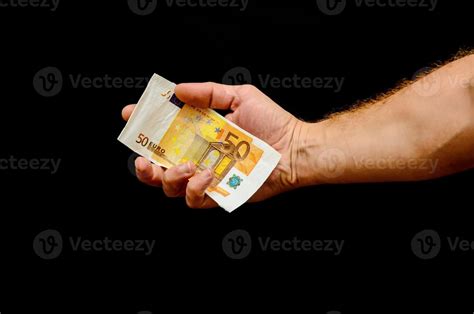 Hand holding cash on black background 17475777 Stock Photo at Vecteezy