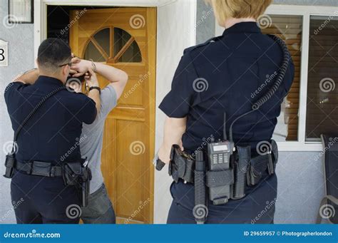 Police Officer Arresting Young Man Stock Image - Image of arrested, male: 29659957