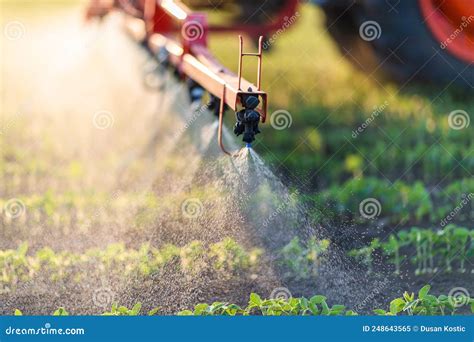 Nozzle of the Tractor Sprinklers Stock Image - Image of spray, field ...