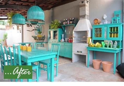 a dining room table with blue chairs and green cabinets