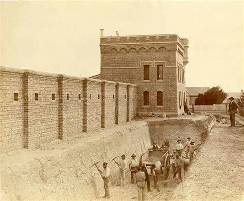 This photograph was taken by Charles Nettleton 14 May 1885 showing workmen digging the moat ...