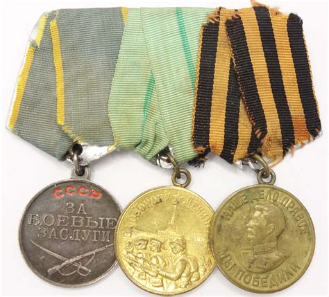 Group of Soviet medals consisting of a medal for Combat Merit #2833606 ...