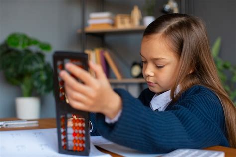 Free Photo | Medium shot girl learning math at school