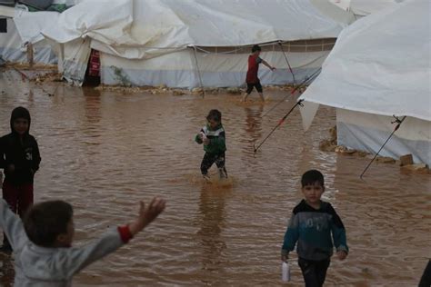 Syria refugees appeal for aid after Idlib camps flooded – Middle East ...