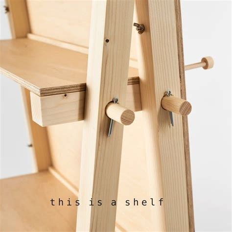 a wooden shelf with two pegs on it and the words, this is ashef