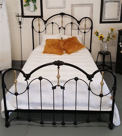 Antique Black Queen Size Iron bed with Gold Accents. Available in the shop, visit us online ...