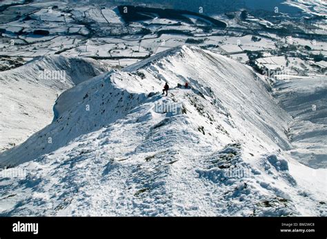 On the Hall's Fell ridge of Blencathra mountain in winter, Lake District, Cumbria, England, UK ...