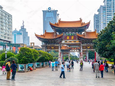 KUNMING, CHINA - SEPTEMBER 9, 2012: Kunming Archway. Traditional chinese gate and modern ...