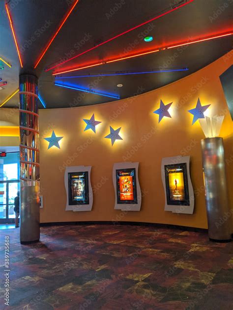 Inside Entrance to Movie Theater Regal Pearl Highlands with movie posters on display Stock Photo ...