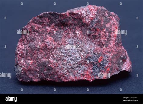 Cinnabar or cinnabarite is a mercury sulfide. Sample with native mercury droplets Stock Photo ...