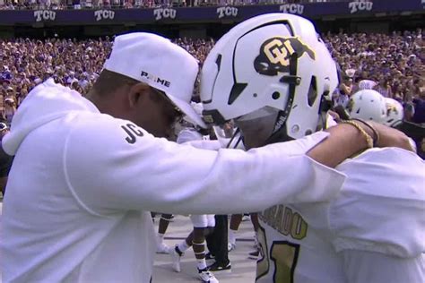 Deion Sanders and Son Shilo Share Warm Embrace Before Colorado Debut