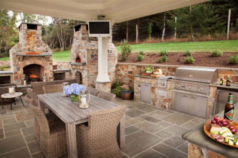 Outdoor kitchen fireplace dinning | Davis Landscape Design & Installation