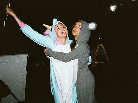 Miley Cyrus and Ariana Grande Debut 'Don't Dream It's Over' Music Video – in Onesies! - Music ...