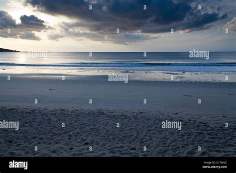 Sunset on the Beach of Jimbaran on Bali, Indonesia Stock Photo - Alamy