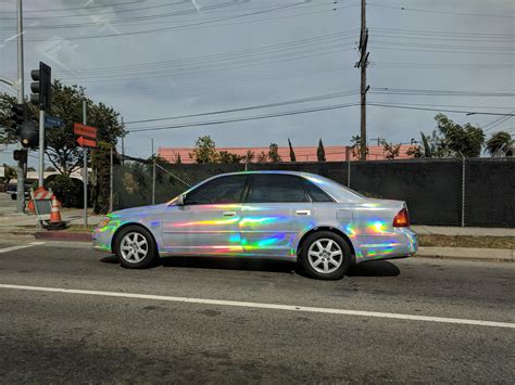 The rainbow iridescence of this car's paint job : r/mildlyinteresting