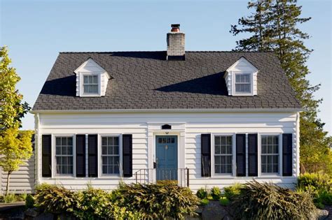 White Cape Cod Traditional White House with Black Shutters and Blue Front Door by Mich… | Cape ...