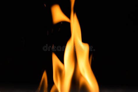 A Flickering Flame of a Hot Fire Isolated on Black Background Stock ...