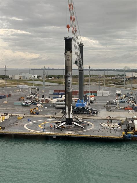 Falcon 9 booster rocket, returned and set down on the "barge", is returned to SpaceX at port, as ...