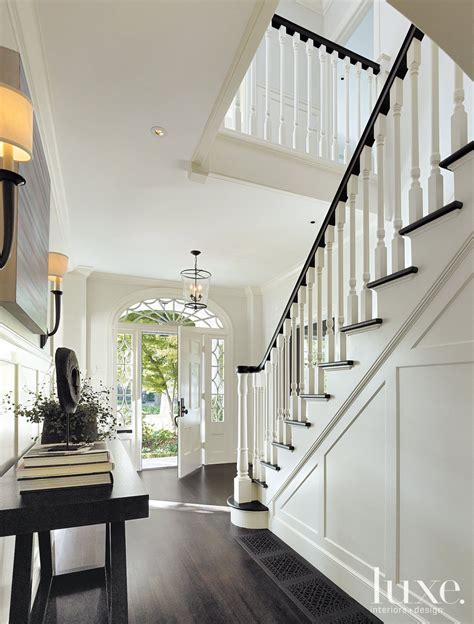 Traditional Black and White Staircase and Entry | Colonial house ...