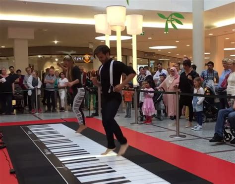 Couple’s Floor Piano Playing Draws Enthusiastic Crowd