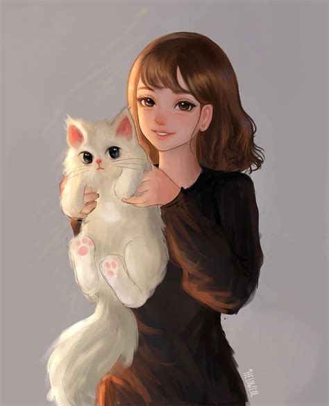 a woman holding a white cat in her arms