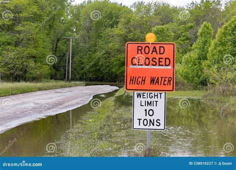 Road Closed Sign and High Water Flooding Roadway Stock Image - Image of ...