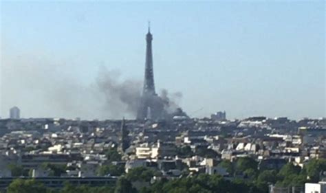 Paris fire: Thick black smoke billows in front of the Eiffel Tower after blaze breaks out ...