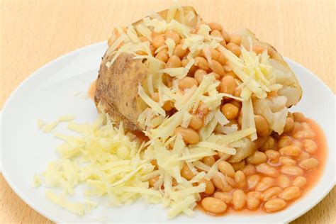 Baked Jacket Potato Filled With Beans And Cheese Stock Photo - Image of ...