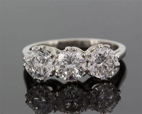 Platinum diamond three stone ring, round cut diamonds, 3 carats