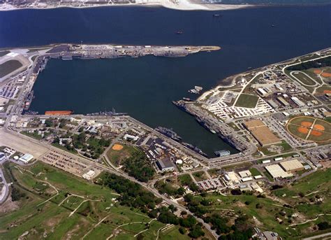 An aerial view of the Mayport Naval Station with various U.S. Navy ships moored at the piers. To ...