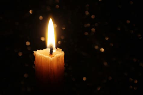 White Candles Burning in the Dark with focus on single candle in foreground. | Society for the ...