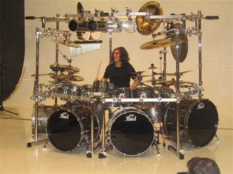 Mike Mangini from Dream Theater and his Pearl drum set. Mangini playing his set just goes to ...