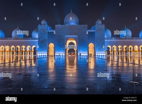 Sheikh Zayed Grand Mosque at Night Covered with Beautiful Blue Lights and light rays Stock Photo ...