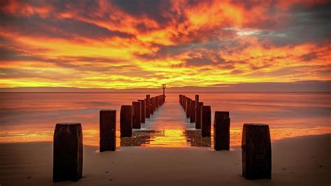 Winter sunrise on Lowestoft Beach Photograph by David Powley - Fine Art America