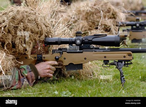 British Infantryman with a long range sniper rifle L115A3 which has a killing capability from ...